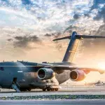 Large military transport aircraft at sunset
