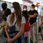 Newly-arrived passengers from California and Turkey wait to be tested for coronavirus (COVID-19) at Tegel (TXL) airport on July 29, 2020 in Berlin