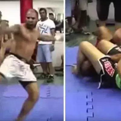 Frau kämpft gegen Mann im Jiu-Jitsu ohne Handschuhe