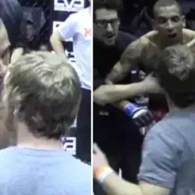 Fan fordert einen Kämpfer im Octagon heraus