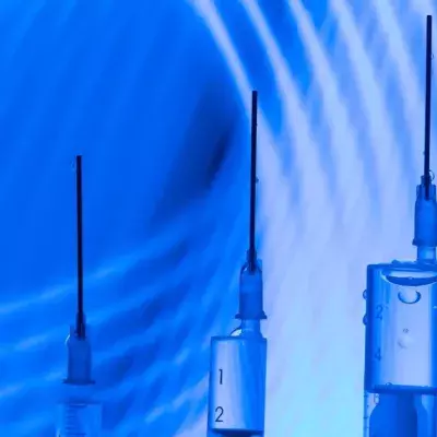 Vaccine research concept: three syringes in a modern laboratory context with curved blue lines