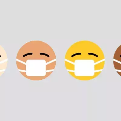 Vier Emojis mit Mund-Nasen-Schutz