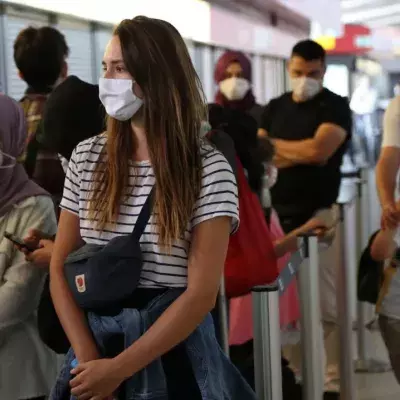 Newly-arrived passengers from California and Turkey wait to be tested for coronavirus (COVID-19) at Tegel (TXL) airport on July 29, 2020 in Berlin