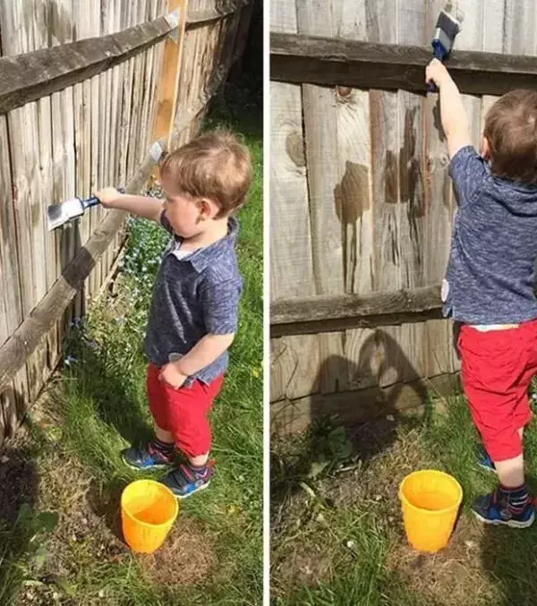 Geniale Eltern-Tricks: Bei Gartenarbeiten kann dein Kind ganz leicht mithelfen, indem es die Zäune mit Wasser bemalt!